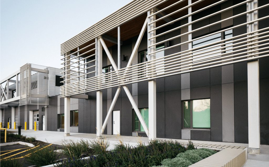 Picture of a building with black exterior panels provided by Longboard Architectural Products.